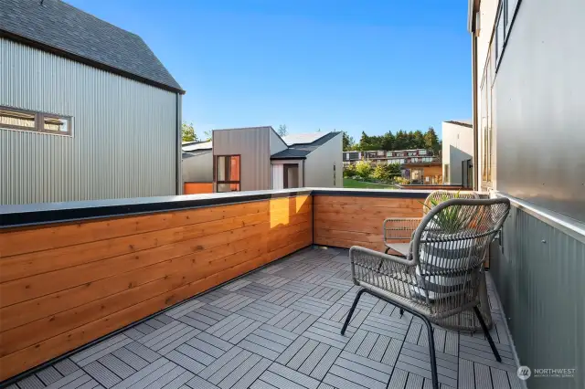 The spacious rooftop deck enhances outdoor enjoyment and provides an ideal setting for entertaining. Image of 206 Shepard Way NW.