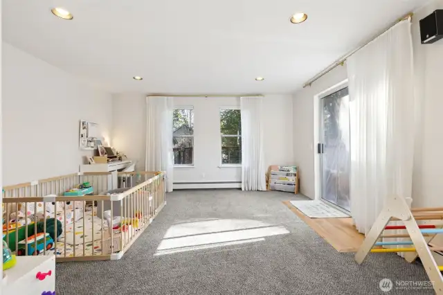 Cozy family room off of the dining area. Sliding glass door takes you to the gated back porch