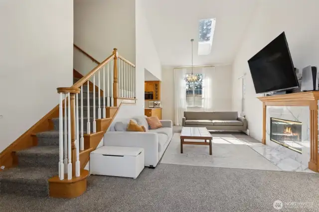 Tons of natural light in the cozy living room. Fireplace is gas