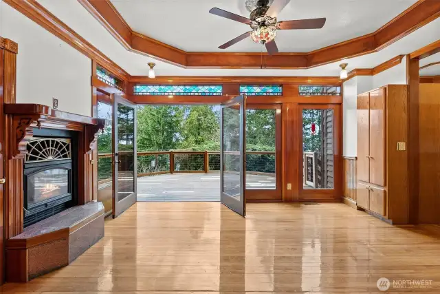 Hardwoods, stained glass windows, and the wood trimmed coffered ceiling compliment this beautiful space.