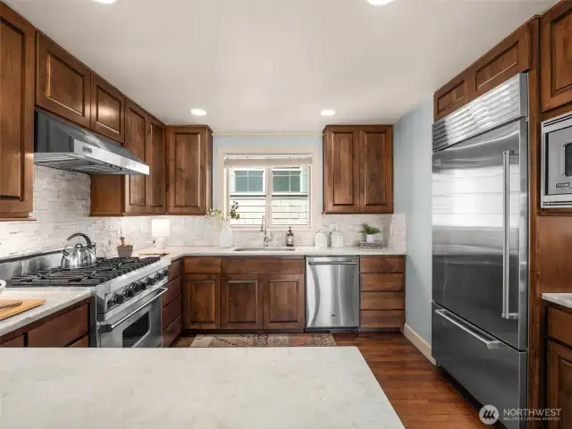 High end Viking appliance package includes: 6-burner stove, hood and microwave; Subzero fridge.  Marble countertops and abundant storage.