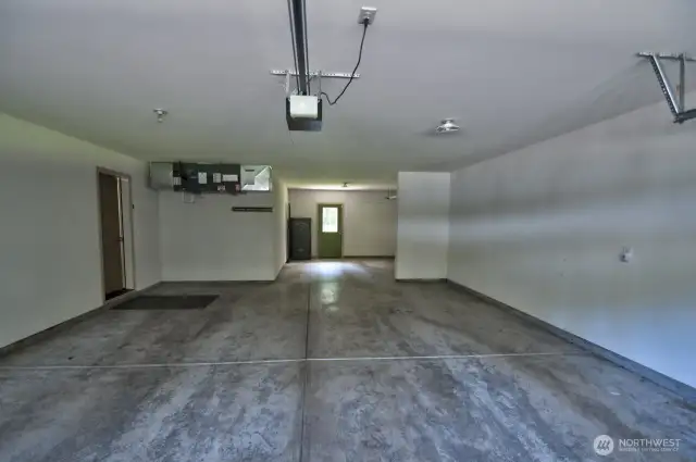 Oversized garage with separate "room" at the back with a door leading to the back yard.