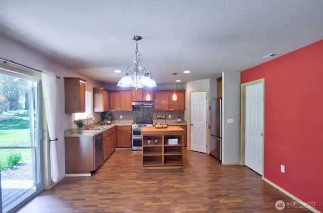 Large dining area; kitchen with plenty of cabinet and counter space, large pantry.