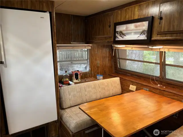 Fridge and dining area.