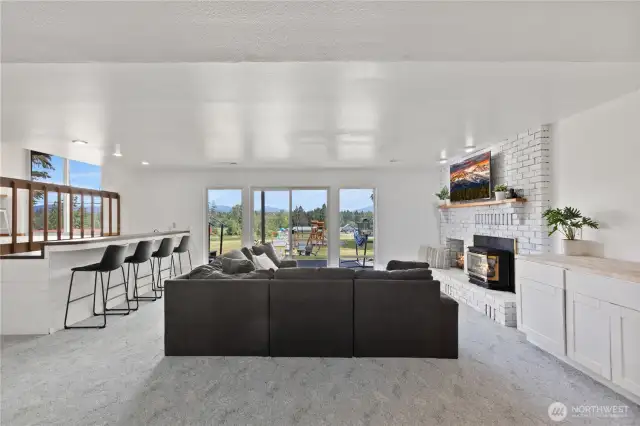 Lower level family room with gas fireplace and walk out patio