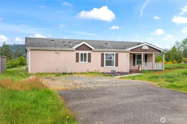 This triple wide manufactured home is located in Prairie Ridge neighborhood in Bonney Lake. This is a cosmetic fixer with good bones and needs some fresh paint and new carpet to make it your home dream come true. On a sunny day, Mt. Rainier will greet you as you grab your morning coffee and there is plenty of parking for your guests when they come and relax on your large back deck with the mountain in the background. This home is sold As-Is.