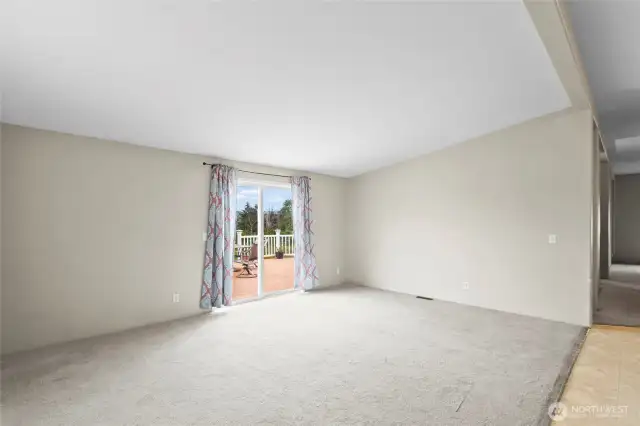 The vaulted ceilings make this family room feel open and airy! With summer just around the corner, you'll love the quick access to the back deck.