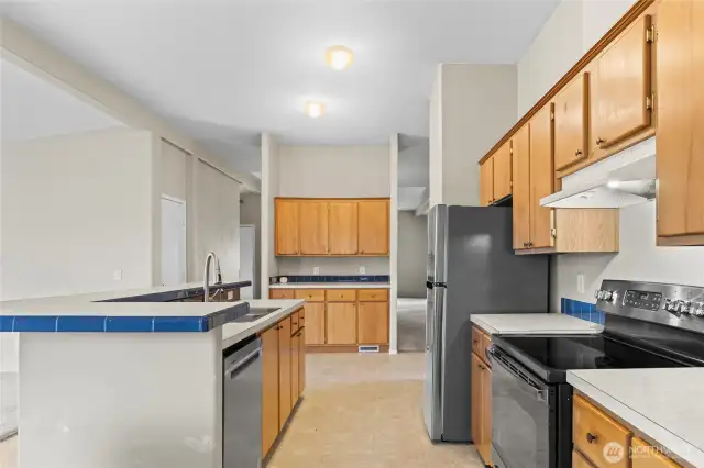 Stainless appliances round out this fabulous space and the door on the left is a closet that could make a great pantry for your dried goods!