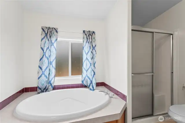 The bathroom window brings in natural light while maintaining privacy and seclusion. The deep soaker tub will be much needed on a cold winter evening.
