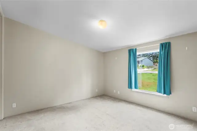 The second bedroom faces the front of the home and is a generous size.