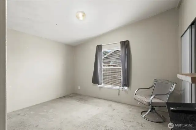 Bedroom 3 is tucked on the north side of the home and will be much improved with a little paint and carpet.
