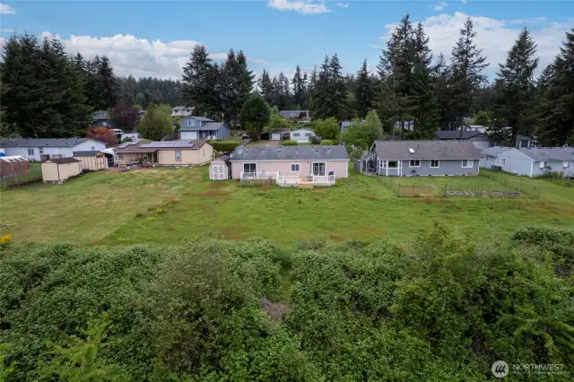 This home is set back on the generously sized lot allowing for optimal privacy while being only minutes away from all major amenities. Note the storage shed to the left, a great spot for your gardening tools!