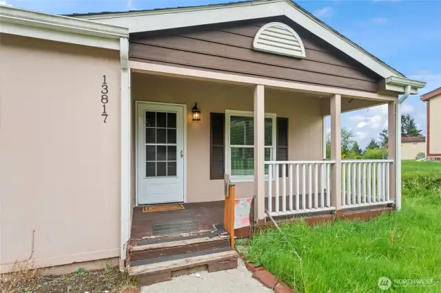 A quaint covered porch perfect for sipping lemonade on a sunny day.