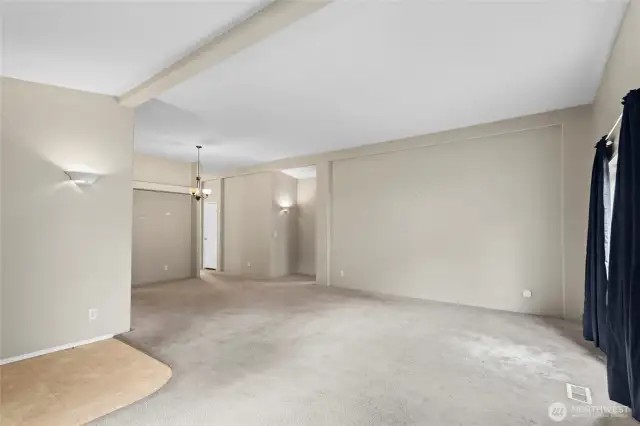 Enter in to this large living room with vaulted ceilings and plenty of natural light. Add some new carpet and paint and this home will shine!