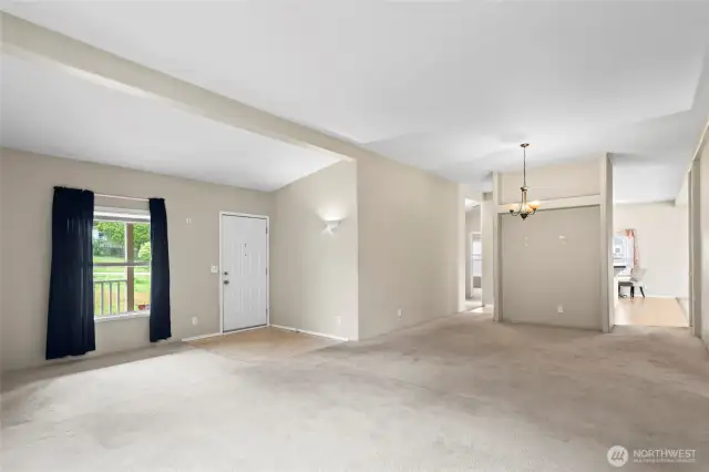 Need a more formal dining space? You've got it! Set up for a crowd or enjoy an evening at home under the chandelier. Continue the hard flooring from the kitchen area through this space for easy maintenance or replace the carpets for a cozy and fresh feel.