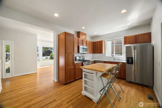 The kitchen is very spacious and has an island.