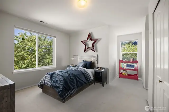 Looking at the virtually staged bedroom with the two dormer alcoves.