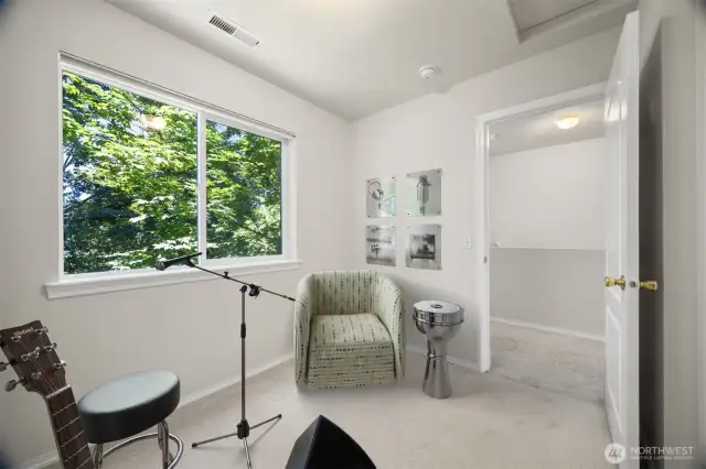 Another bedroom with staging as a music room.
