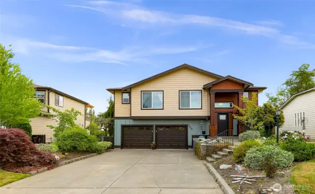 From this angle, the home’s entry path and vibrant garden beds lead you toward the covered front porch. Nestled in the secure Sealinks community, the home’s welcoming façade sets the tone for comfort within.