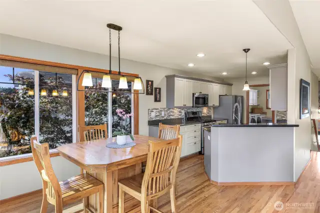 From the dining nook, enjoy beautiful backyard views and the convenience of a central location between kitchen and living room—perfect for morning coffee or hosting friends