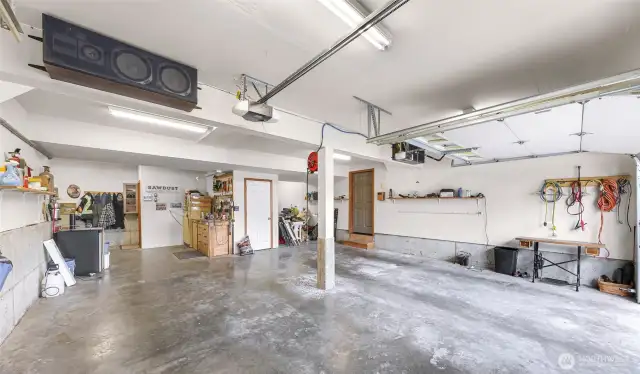 The oversized garage includes dual bays, work areas, and utility storage—ideal for projects, hobbies, and all your Northwest adventure gear.