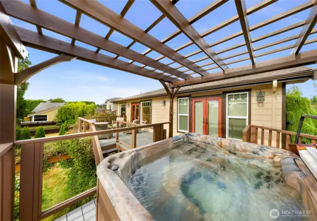 This hot tub and deck combo blends luxury with tranquility, offering a perfect perch to unwind with views of gardens and nearby forested greenspace.