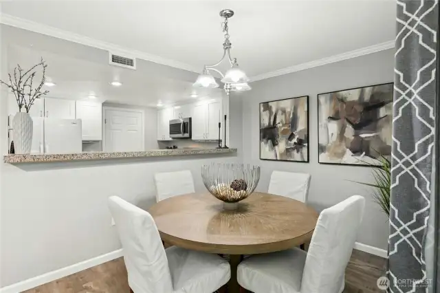 Open-concept living and dining area flows effortlessly into the kitchen and private patio — the perfect layout for modern living.