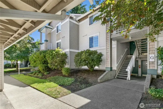 Inviting front entry with a covered patio space, ideal for a welcoming touch and year-round comfort in the Pacific Northwest climate.