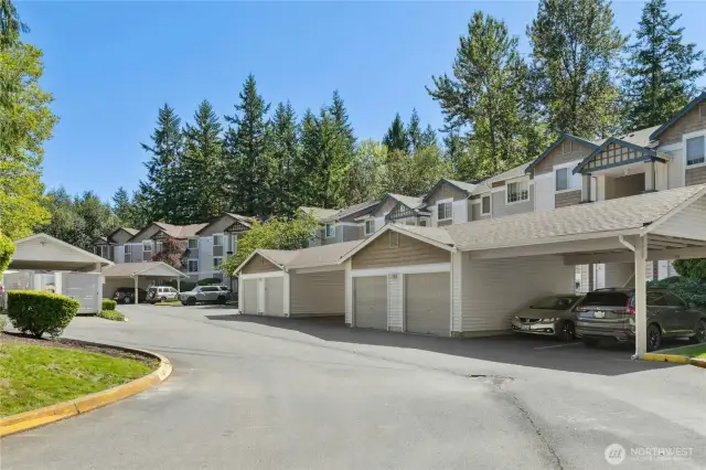 Sundance Community Parking & Setting - Two allocated uncovered parking spaces come with this one-bedroom unit. The attractive architecture is complemented by a lush, tree-lined backdrop for a serene Northwest setting.