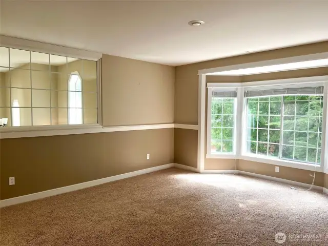 Converted bonus/family room: glass wall enclosed, new door + closet, now an upgraded bedroom.