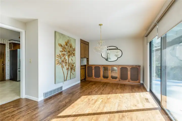 Spacious dining room includes kitchen pass-through and slider to the expansive deck