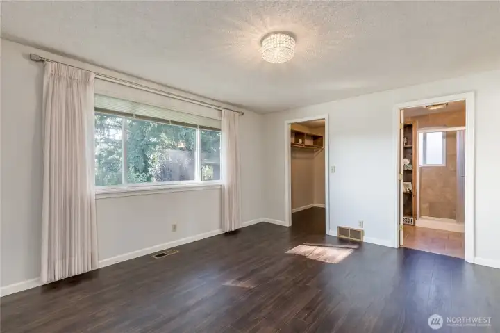 Primary suite on the main floor has walk-in closet and private 3/4 bath
