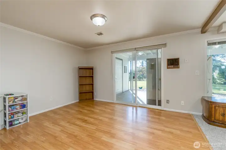 Basement dining area with slider to covered back patio