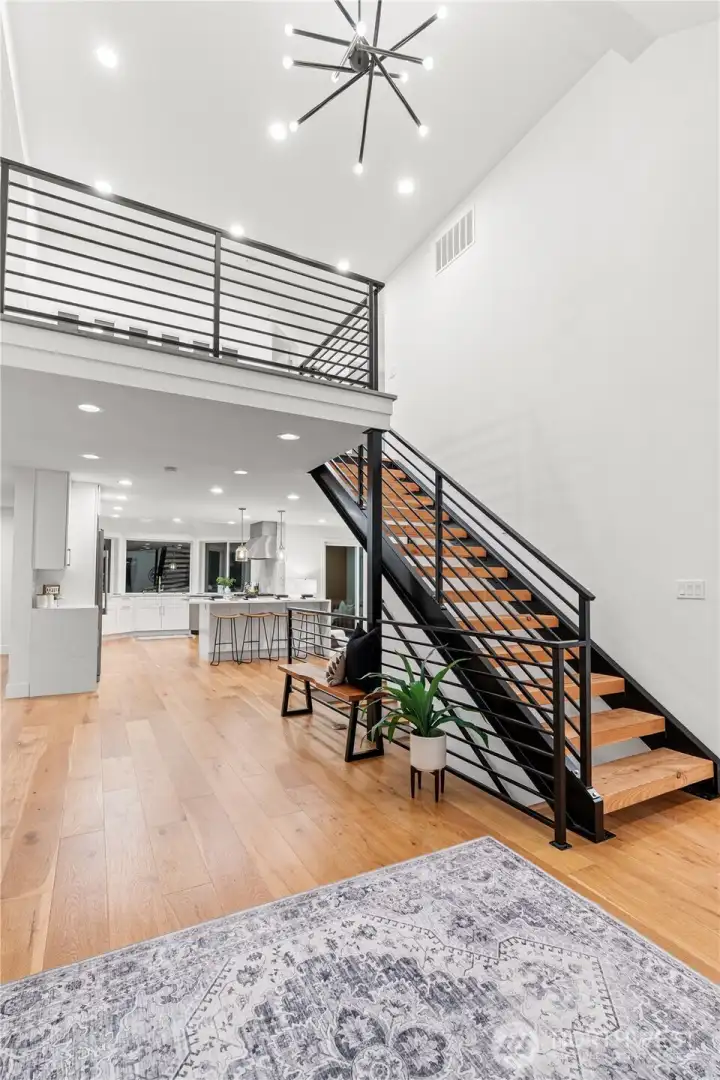 Entryway showcasing the floating staircase