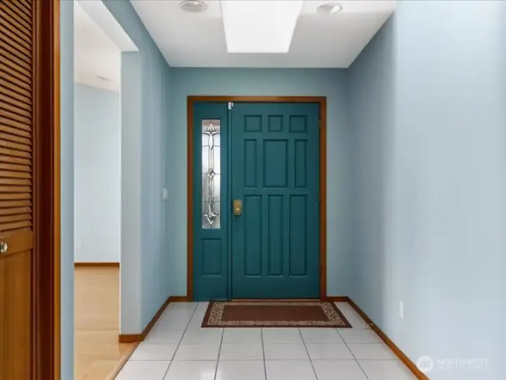 Entry is always beaming with natural sunlight from the skylights