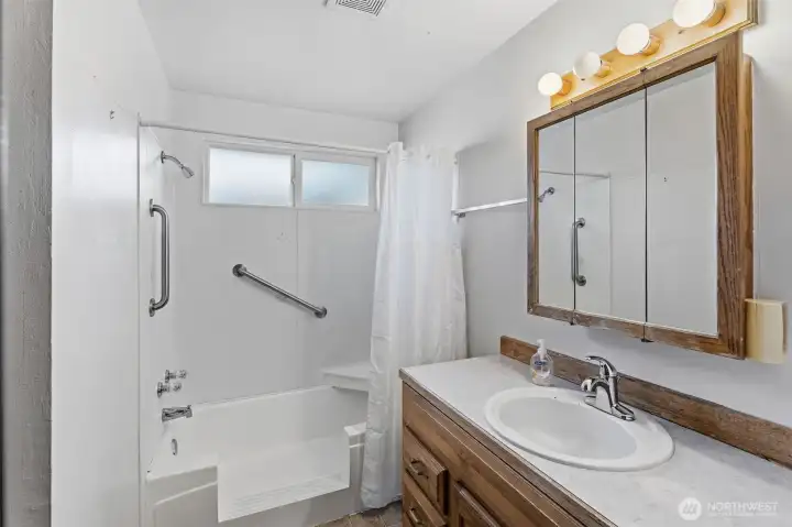 3/4 bath in hall between 3 bedrooms