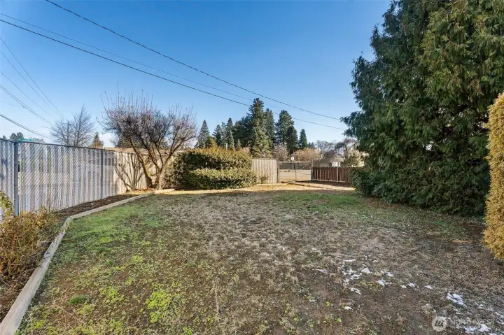 side fully fenced yard