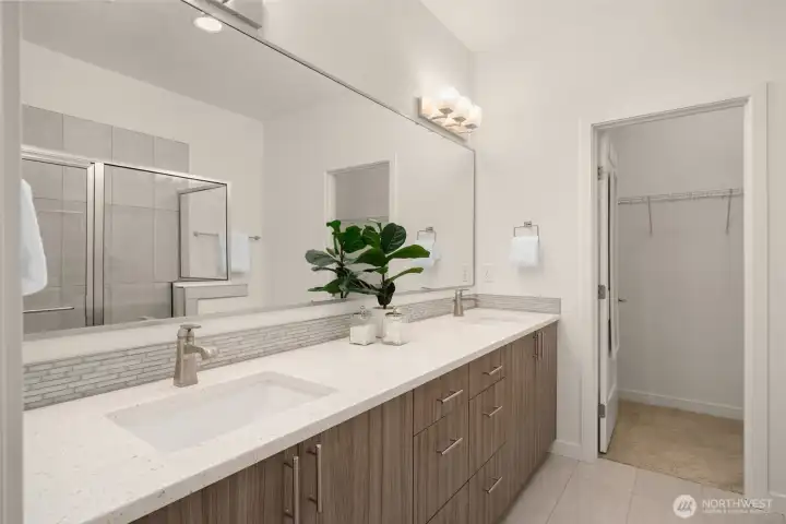 Ensuite bathroom w/ walk-in closet (staged)