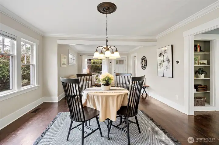 Dining room with crown molding and stained fir floors