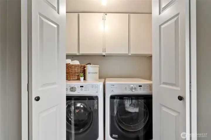 Main floor laundry with built-in storage