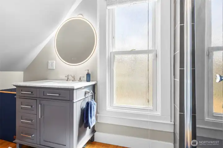 Primary suite bathroom w/ heated mirror