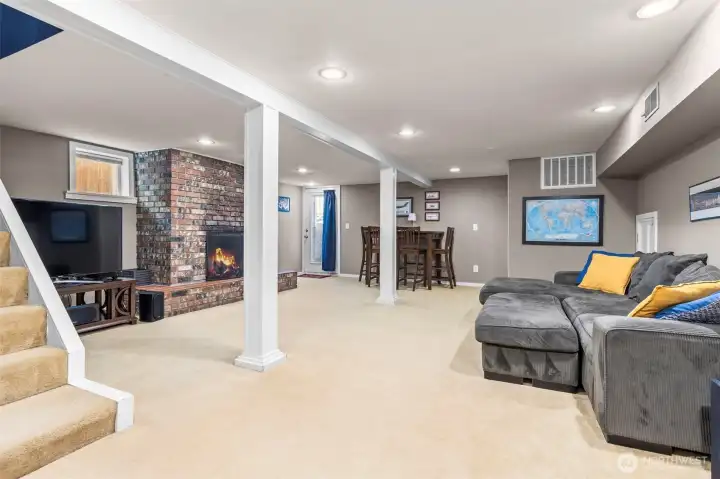 Downstairs family room w/ fireplace, and seperate entry