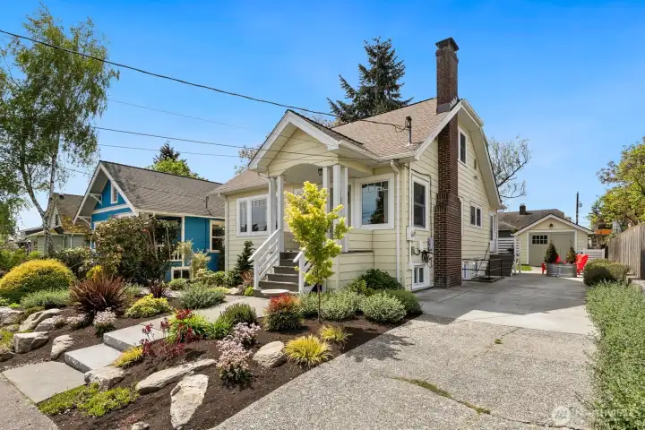 This adorable craftsman has a private driveway with parking for 2+ cars - and a detached one-car garage! Note the EV Charger pictured near the chimney!