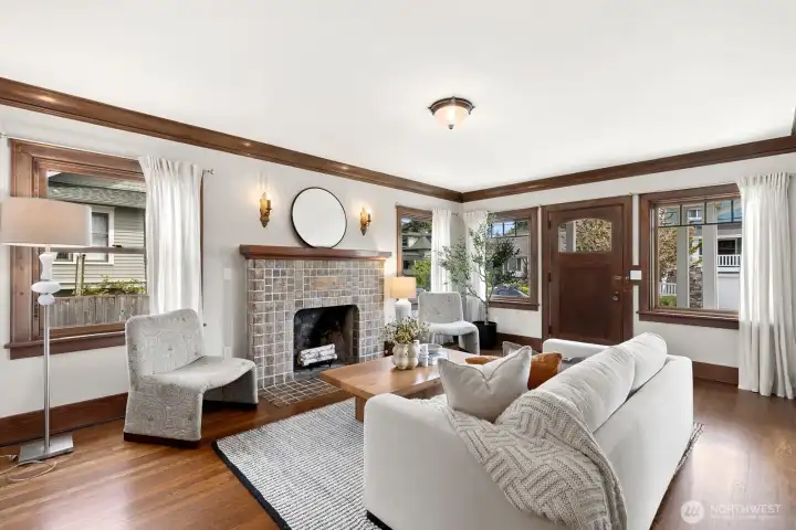 Beautiful wood accents compliment this adorable home. The living room is complete with a Batchelder fireplace.