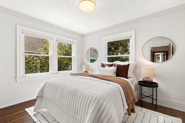 Main floor bedroom sits in back where it's quiet and serene, overlooking the lush backyard.
