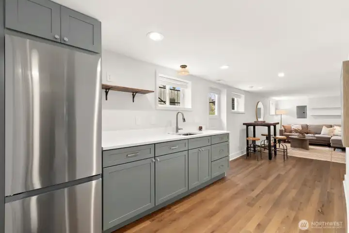 Head downstairs to the lower level that was finished/remodeled in 2023 (formerly unfinished space). The remodel consisted of full waterproofing and seismic retrofitting.