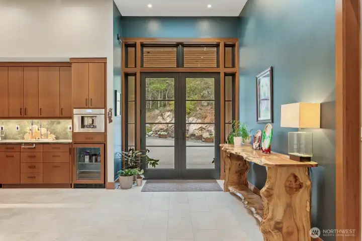 Step into the entry open to kitchen and dining space.  Entire home is ceramic tile with radiant heat.