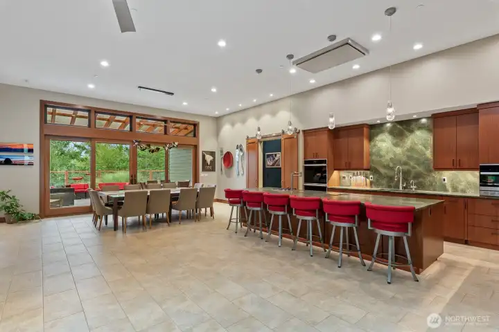 View from entry.  Anderson doors and windows throughout home.  Sliding door leads to covered outdoor living area.  Barn doors in corner lead to primary suite.