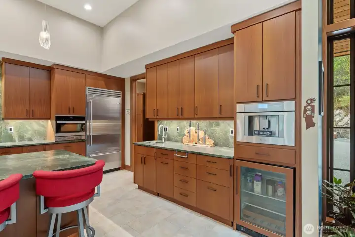 Prep sink for your beverage area next to built in Thermador coffer maker.  Wine cooler/beverage fridge.  The refrigerator is a Bluestar.