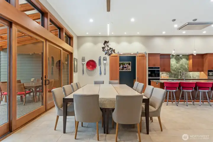 Dining space to entertain large groups and can flow in and out to covered patio.  Custom blinds throughout home with auto window openers in living room and primary bedroom.